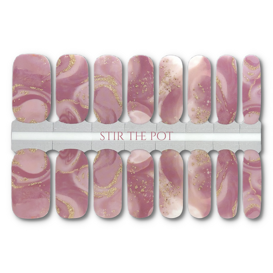 16 Real nail polish strips also called nail wraps or nail stickers. A semi transparent wrap featuring a swirling mixture of mauve and gold glitter.